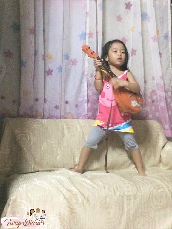 kid playing music